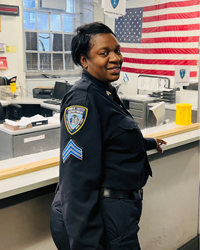 Sgt. Foo in front of the Public Safety Office