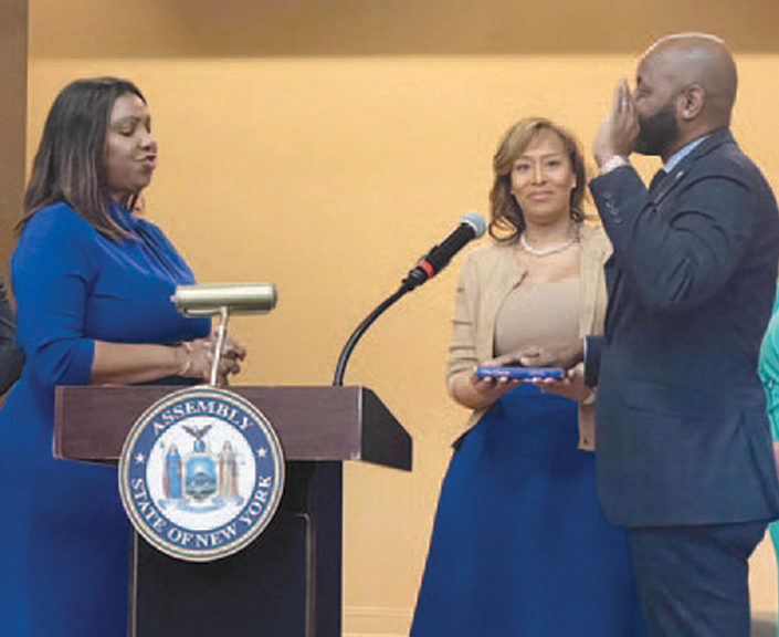 Kwani O’Pharrow is sworn into office by NYS Attorney General Letitia James as the new Assemblyman’s proud wife holds the bible.