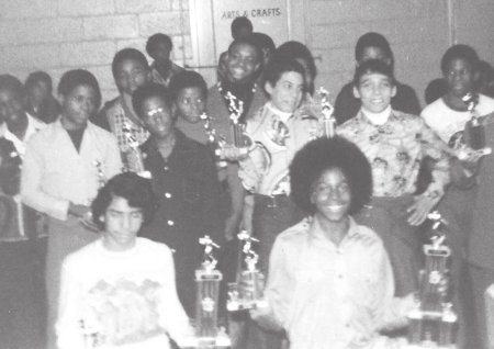 Team members hold their trophies